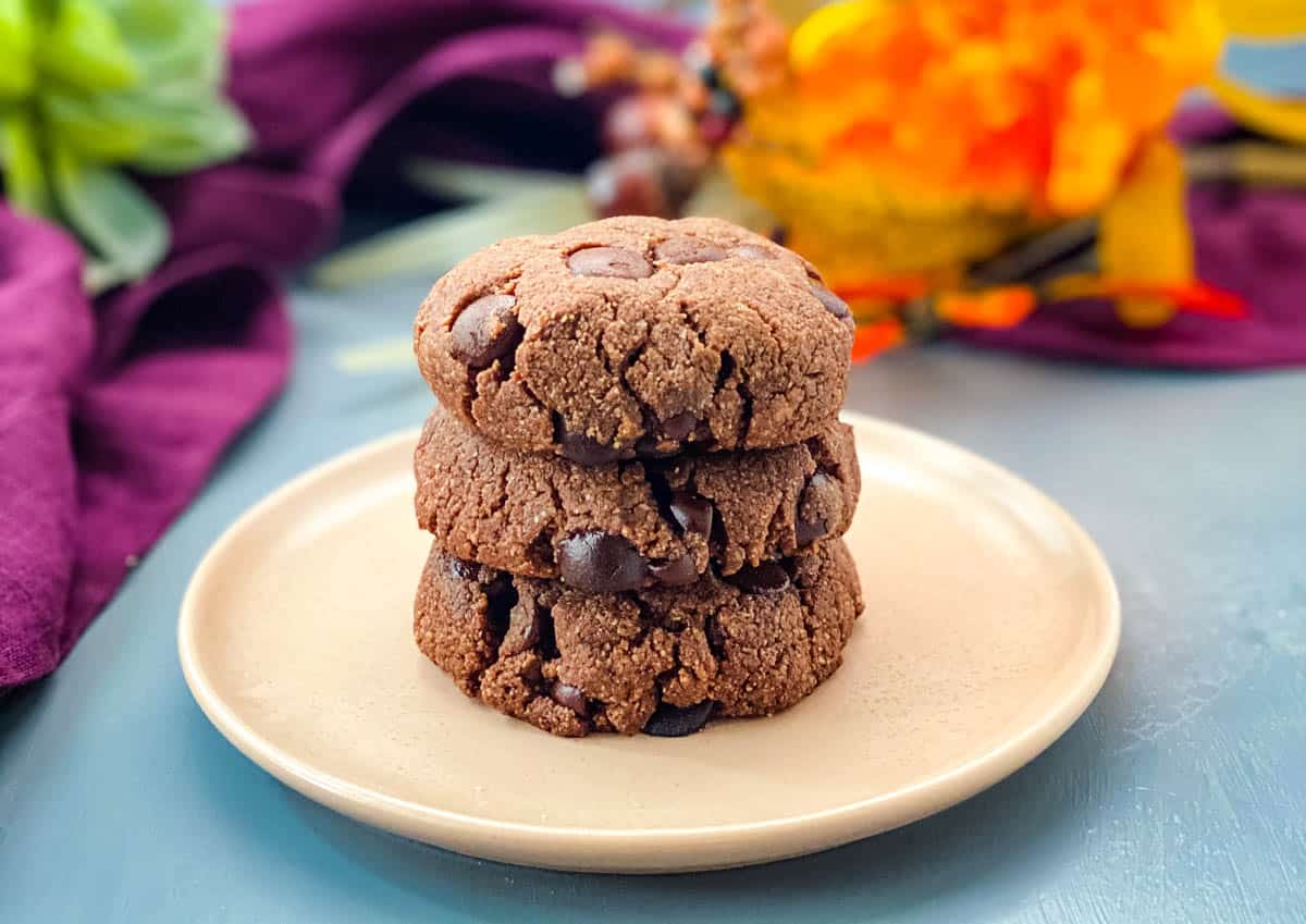 keto low carb double chocolate cookies on a pink plate with a purple napkin