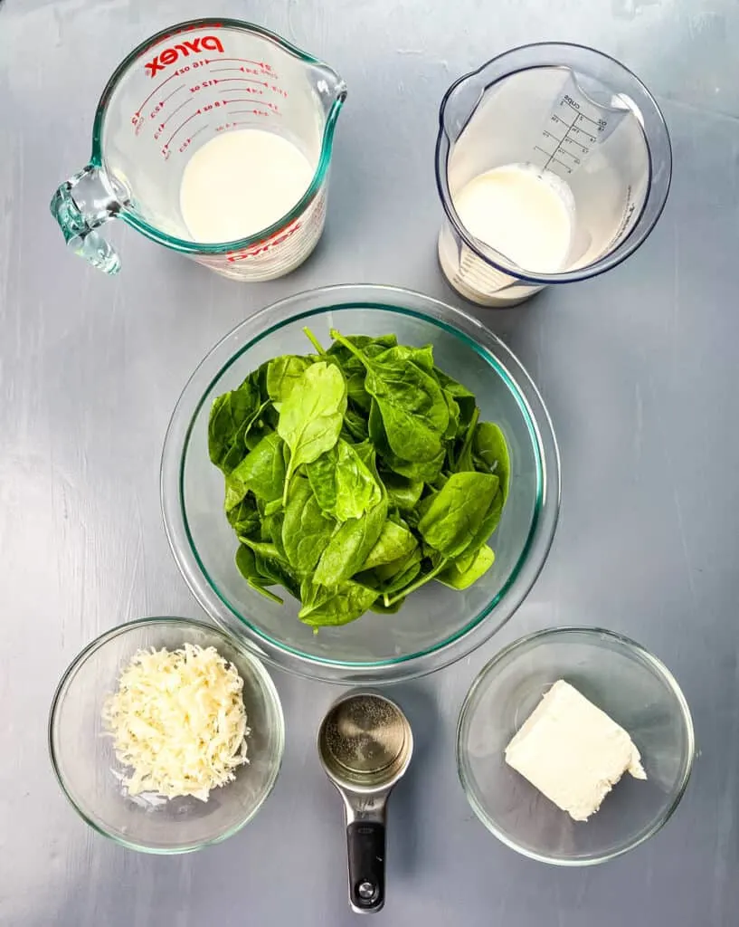 heavy cream, milk, fresh spinach, parmesan cheese, white wine, and cream cheese in separate bowls