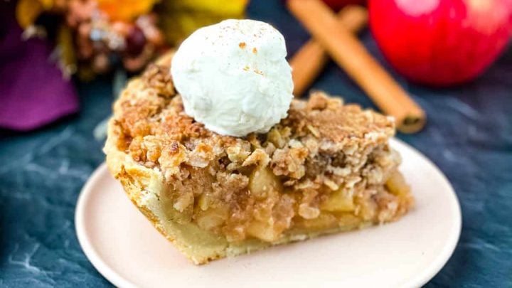 sugar free apple pie on a pink plate with vanilla ice cream