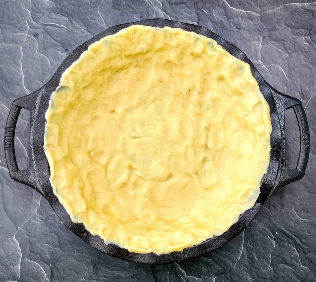 unbaked pie crust in a pie plate