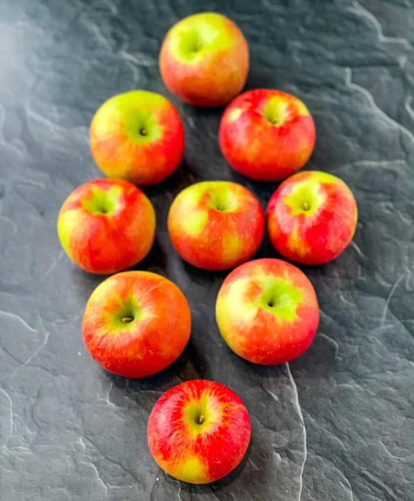 fresh honey crisp apples on a flat surface