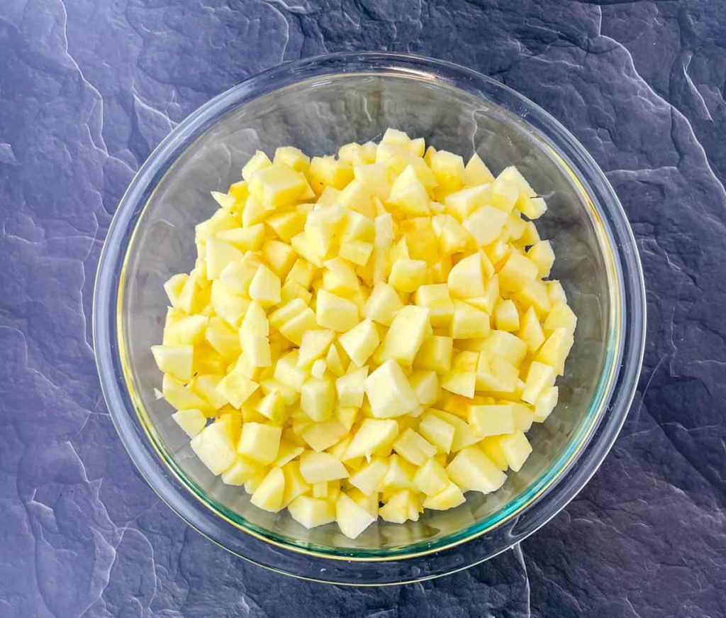 cut honey crisp apples in a glass bowl