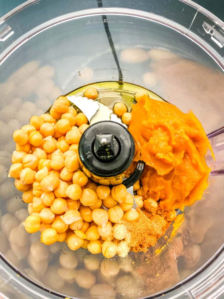 un-blended pumkin hummus in a food processor