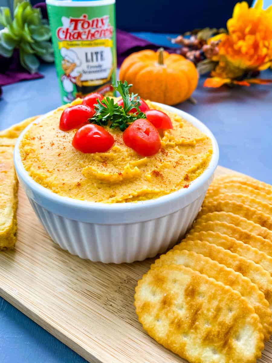 pumpkin hummus on a plate with crackers and cornbread
