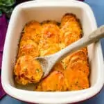 au gratin sweet potatoes in a red baking dish