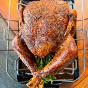 cajun roasted turkey in a roasting pan