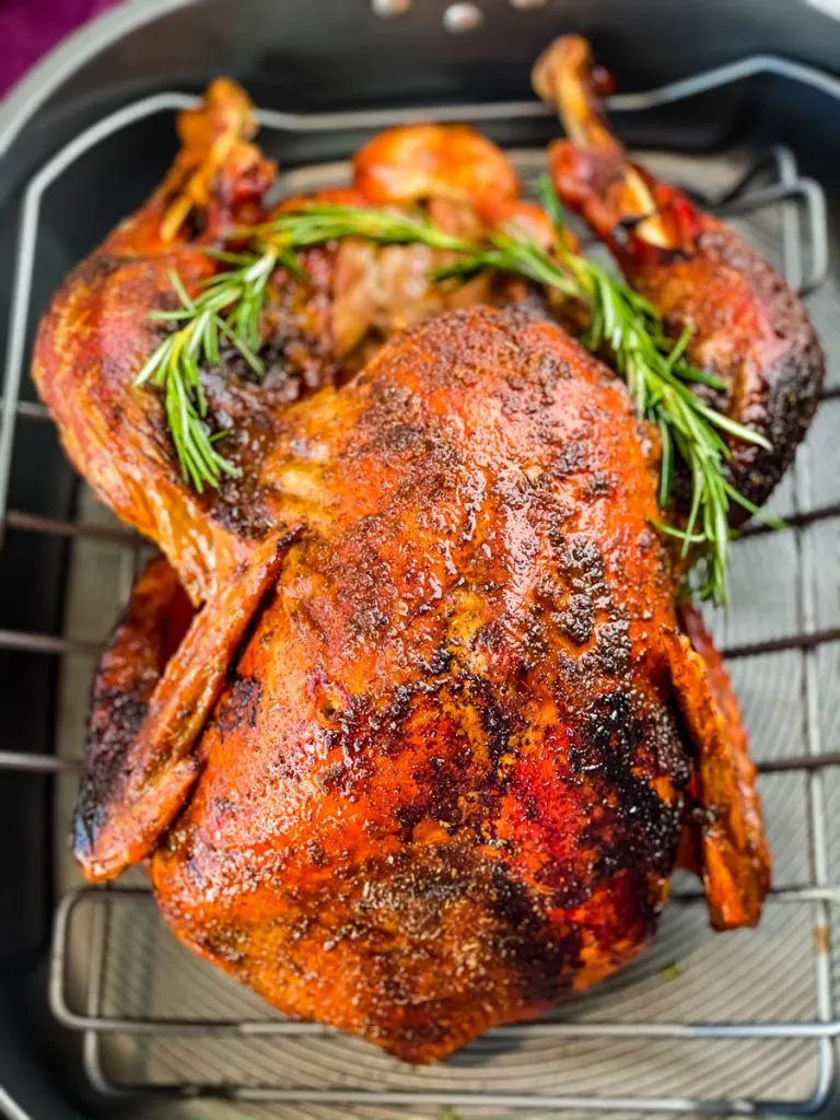 cajun roasted turkey in a roasting pan