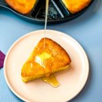 honey drizzled onto a slice of cornbread