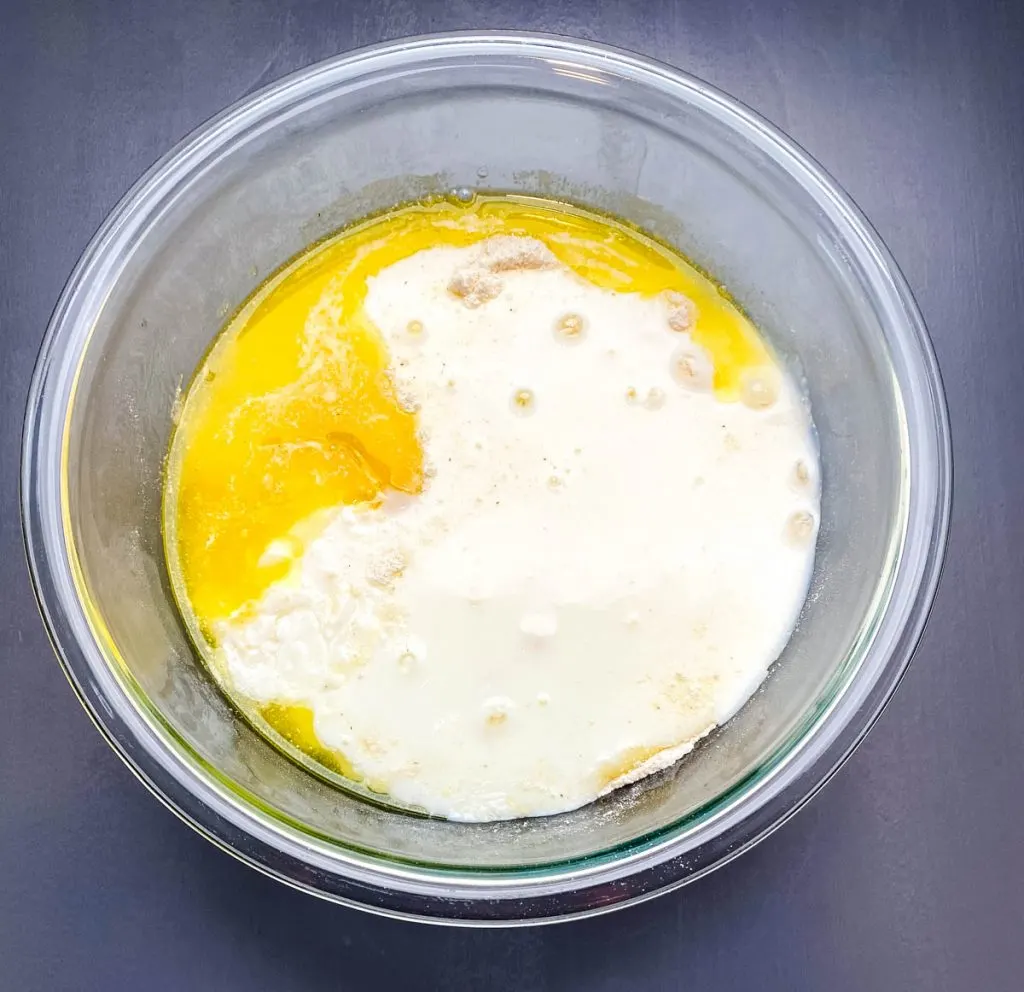 honey cornbread batter in a glass bowl