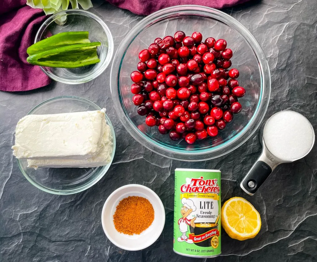 fresh cranberries, cream cheese, sweetener, and Creole seasoning in separate bowls