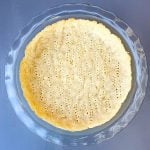 keto pie crust baked in a glass pie plate pan