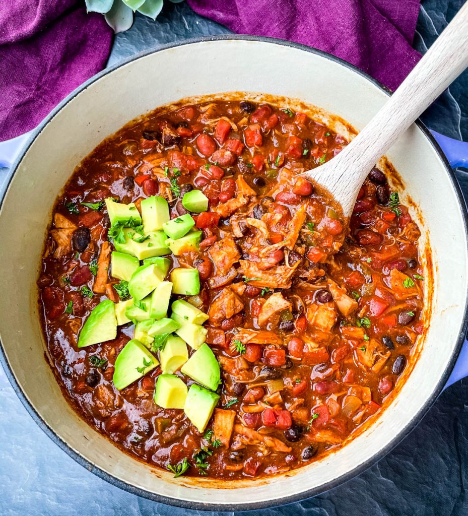 leftover turkey chili in a purple Dutch oven