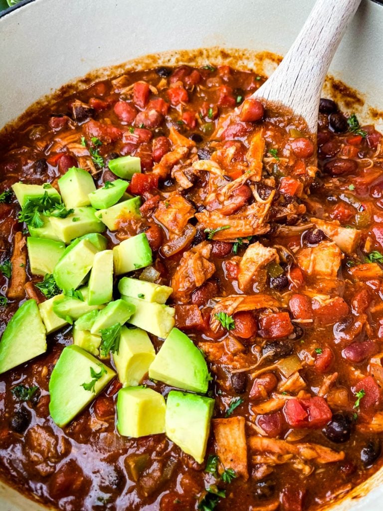 leftover turkey chili in a purple Dutch oven