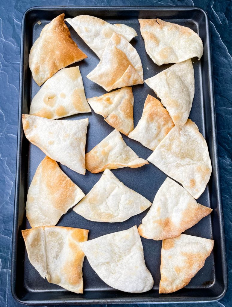 tortilla chips on a sheet pan