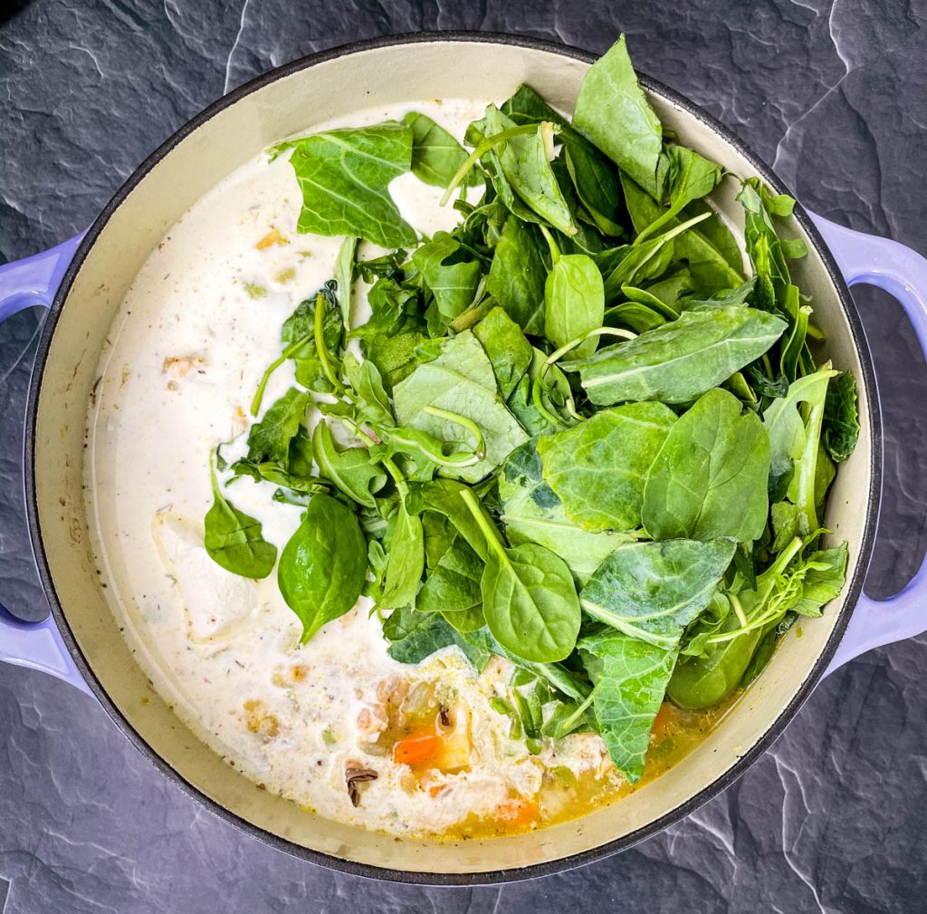 uncooked turkey wild rice soup in a Dutch oven