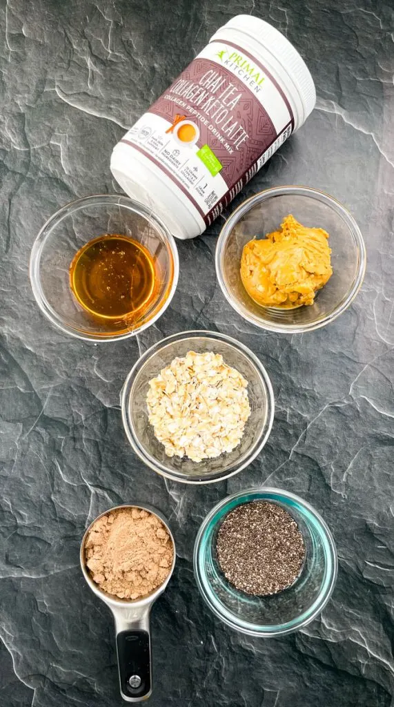 honey, almond butter, rolled oats, chia seeds, chai collagen, and honey in separate bowls