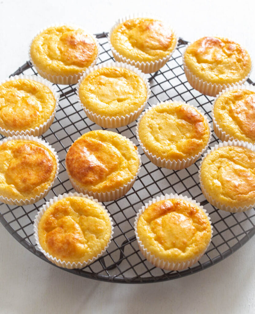 baked sugar free vanilla cupcakes on a cooling rack