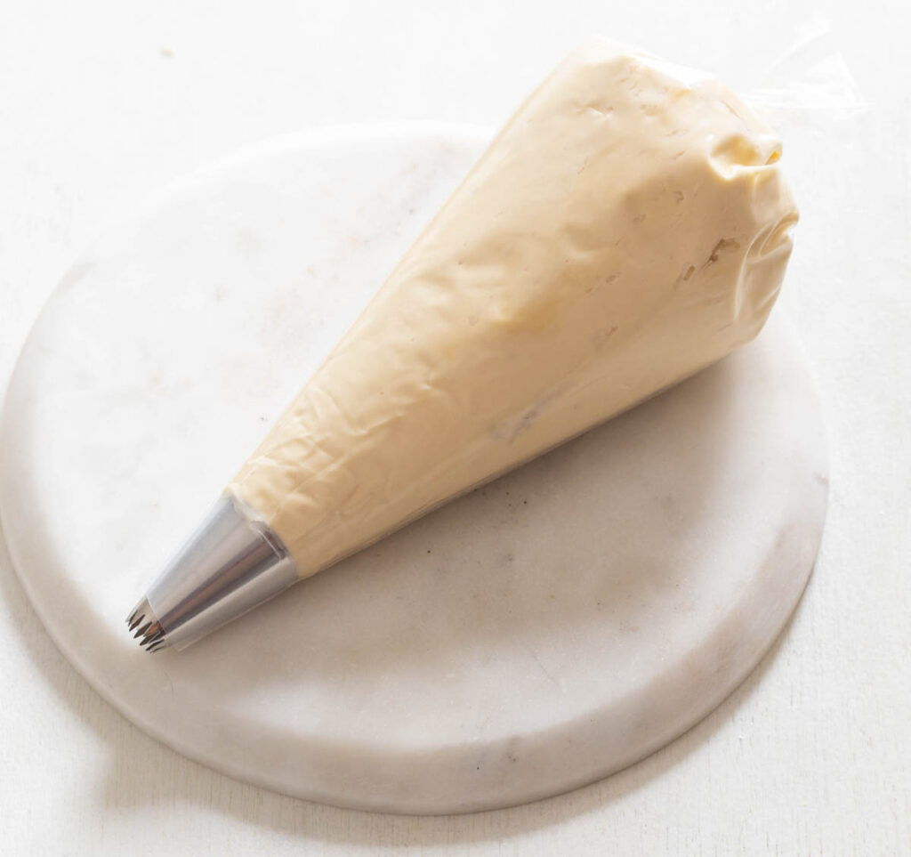 sugar free buttercream frosting in a piping bag