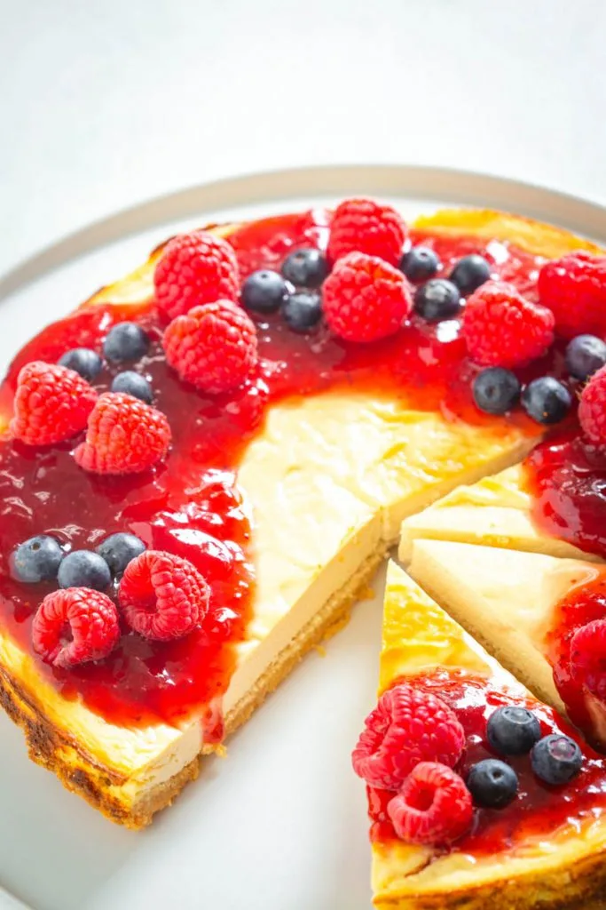 sugar free cheesecake on a plate with berries