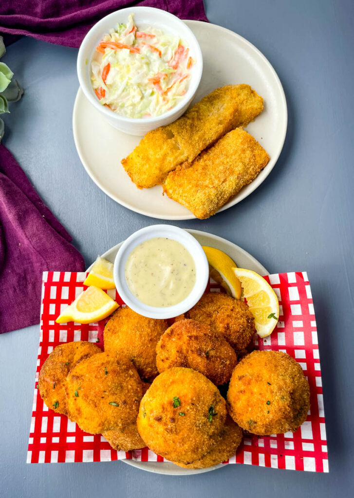 air fryer hushpuppies on a plate with fried fish and coleslaw