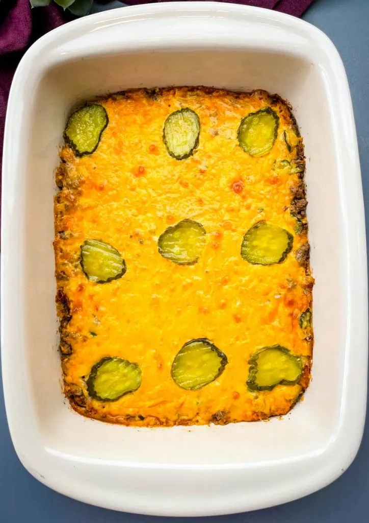 Big Mac Casserole in a baking dish topped with pickles