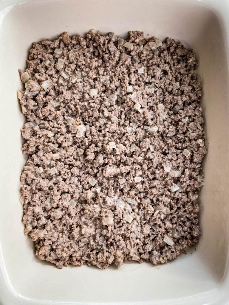 cooked ground beef in a casserole dish