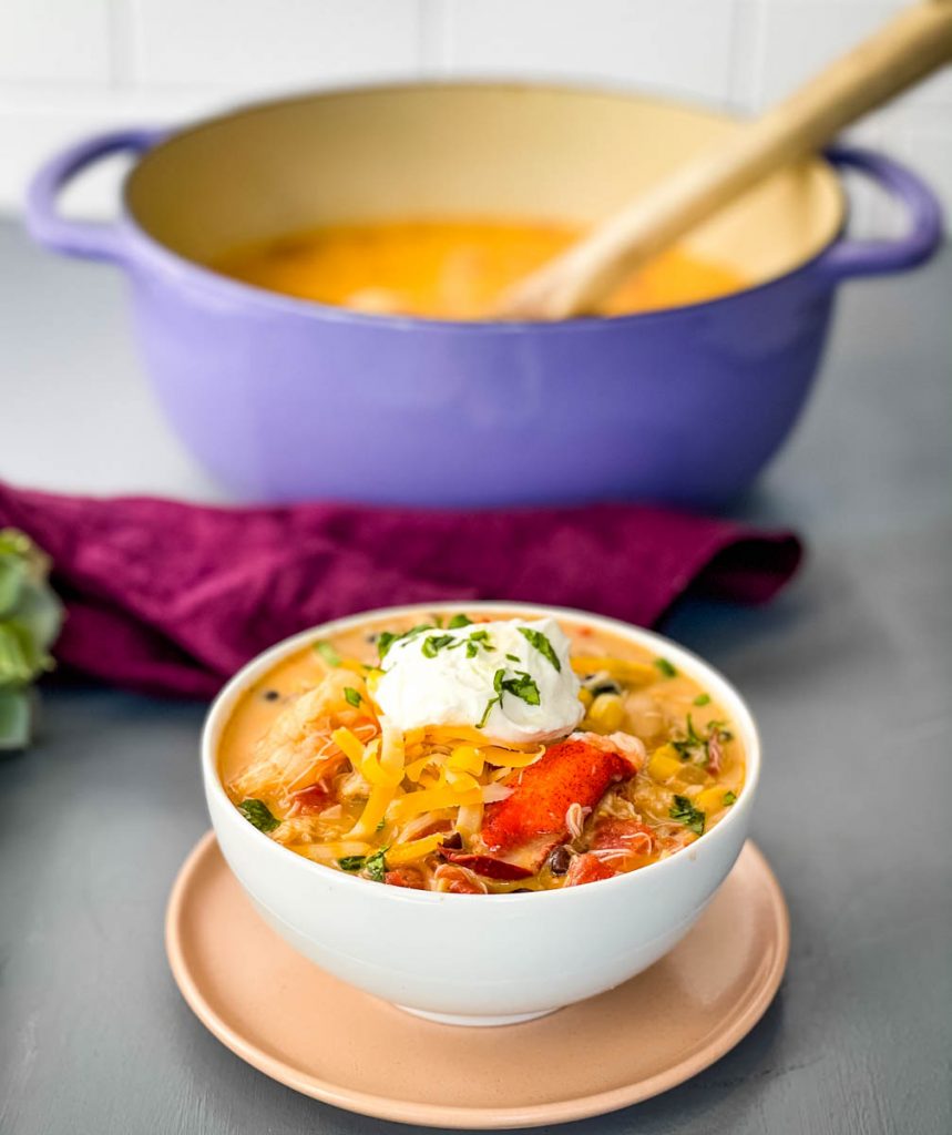 creamy seafood chili with shrimp and lobster in a white bowl