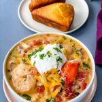 creamy seafood chili with shrimp and lobster in a white bowl