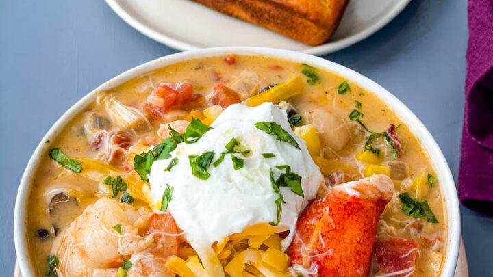 creamy seafood chili with shrimp and lobster in a white bowl