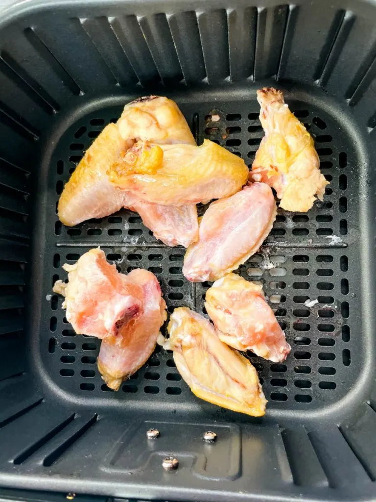 https://www.staysnatched.com/wp-content/uploads/2021/01/frozen-air-fryer-chicken-wings-2-1-768x1024.jpg.webp