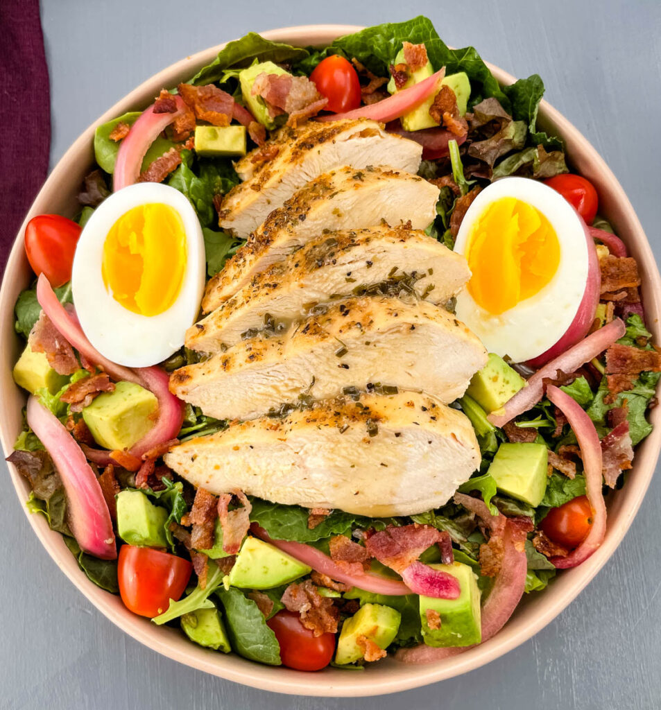 green goddess cobb salad in a bowl with eggs