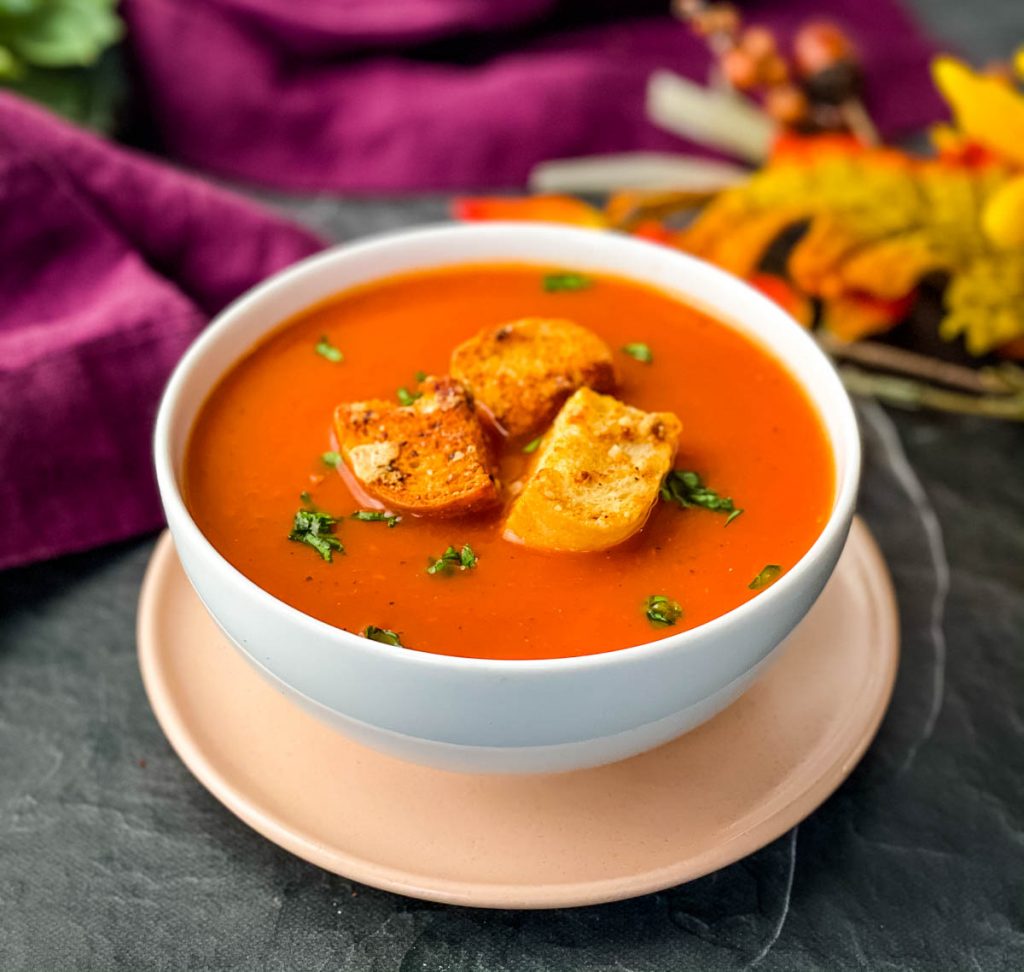 Instant Pot tomato soup in a white bowl