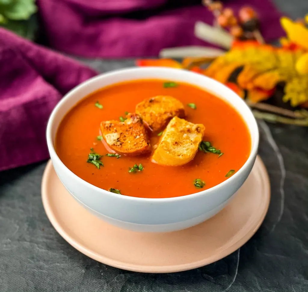 Instant Pot tomato soup in a white bowl
