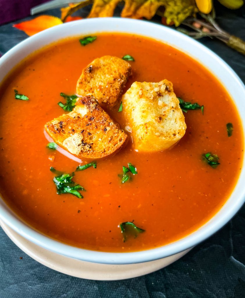 Instant Pot tomato soup in a white bowl