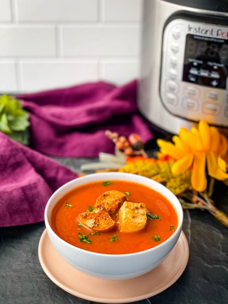 Instant Pot tomato soup in a white bowl