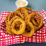 keto low carb onion rings in a red and black basket