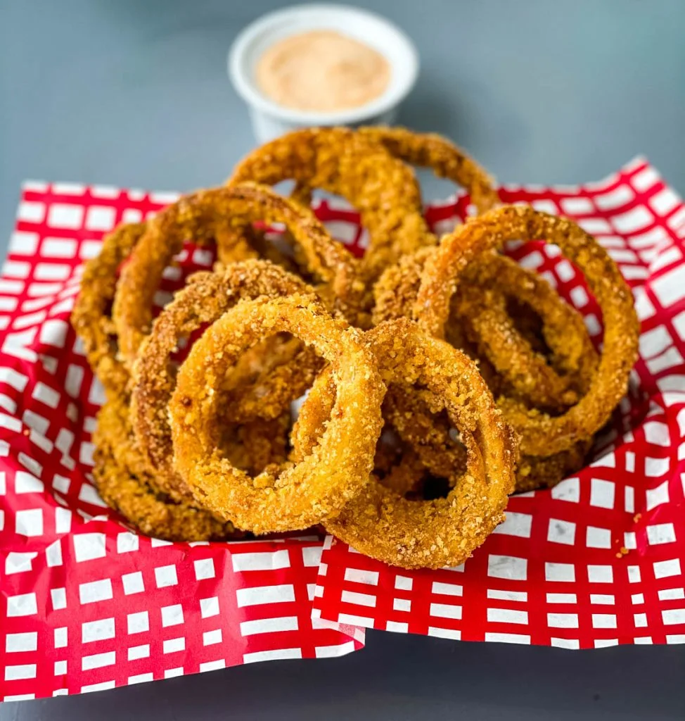 keto low carb onion rings in a red and black basket