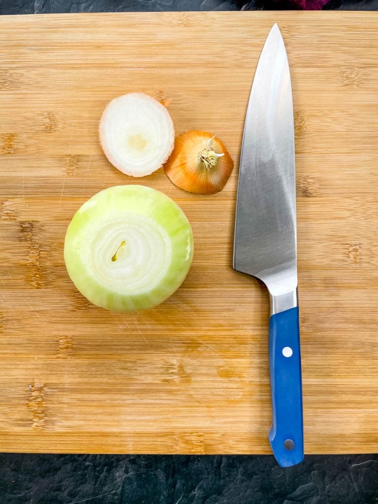 Raw vidalia onion on a cutting board