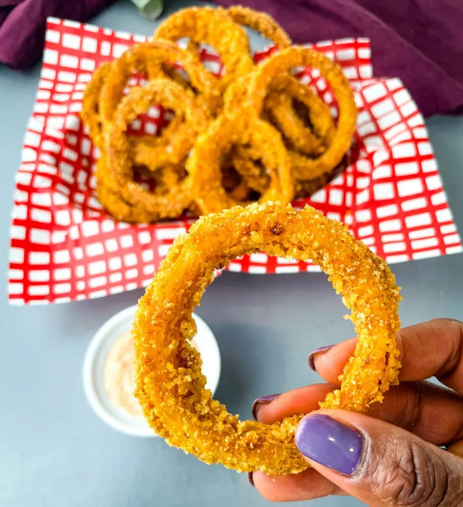 person holding a keto low carb onion ring
