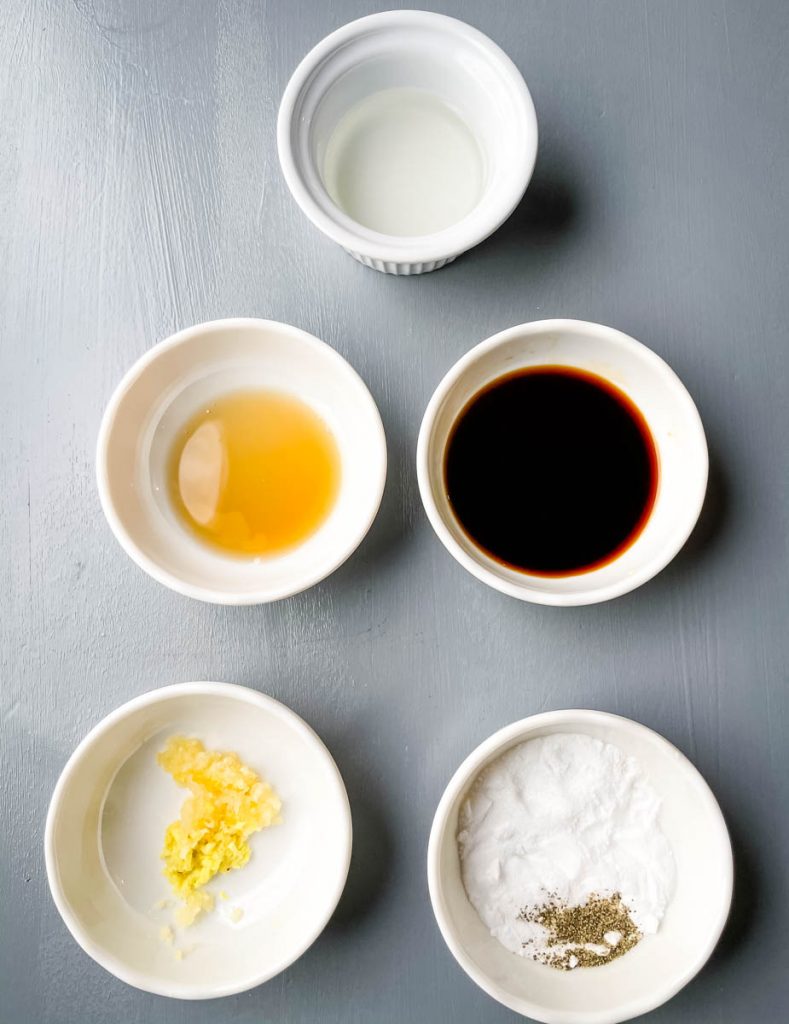 vinegar, garlic, ginger, soy sauce, sesame oil, and baking powder in separate bowls