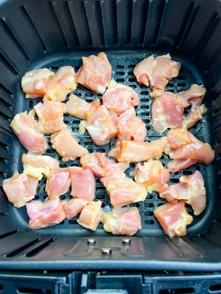 raw chicken thighs in an air fryer