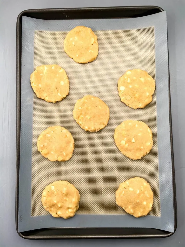unbaked keto macadamia nut cookies on a cookie sheet