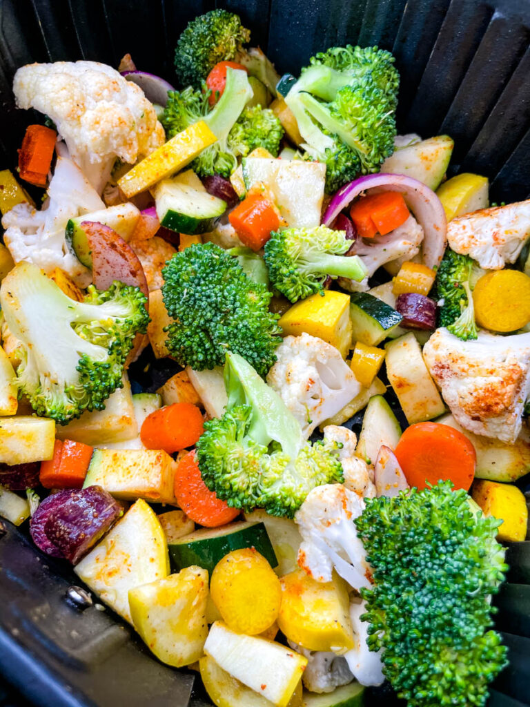 squash, zucchini, onions, carrots, broccoli, and cauliflower in an air fryer