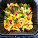 squash, zucchini, onions, carrots, broccoli, and cauliflower in an air fryer