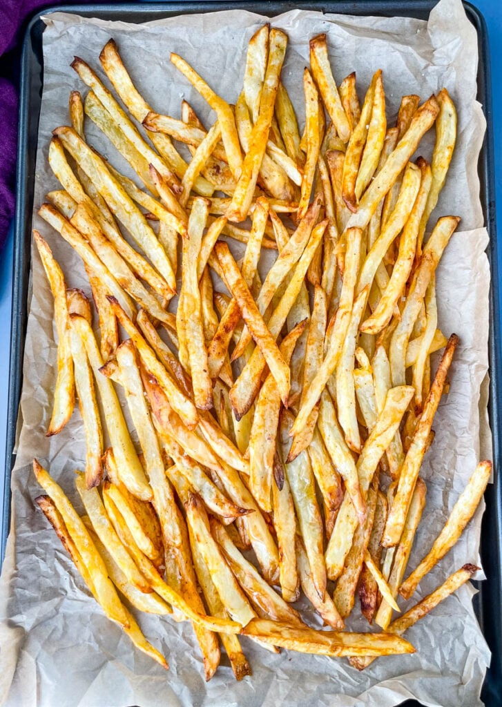 cooked French fries on a sheet pan
