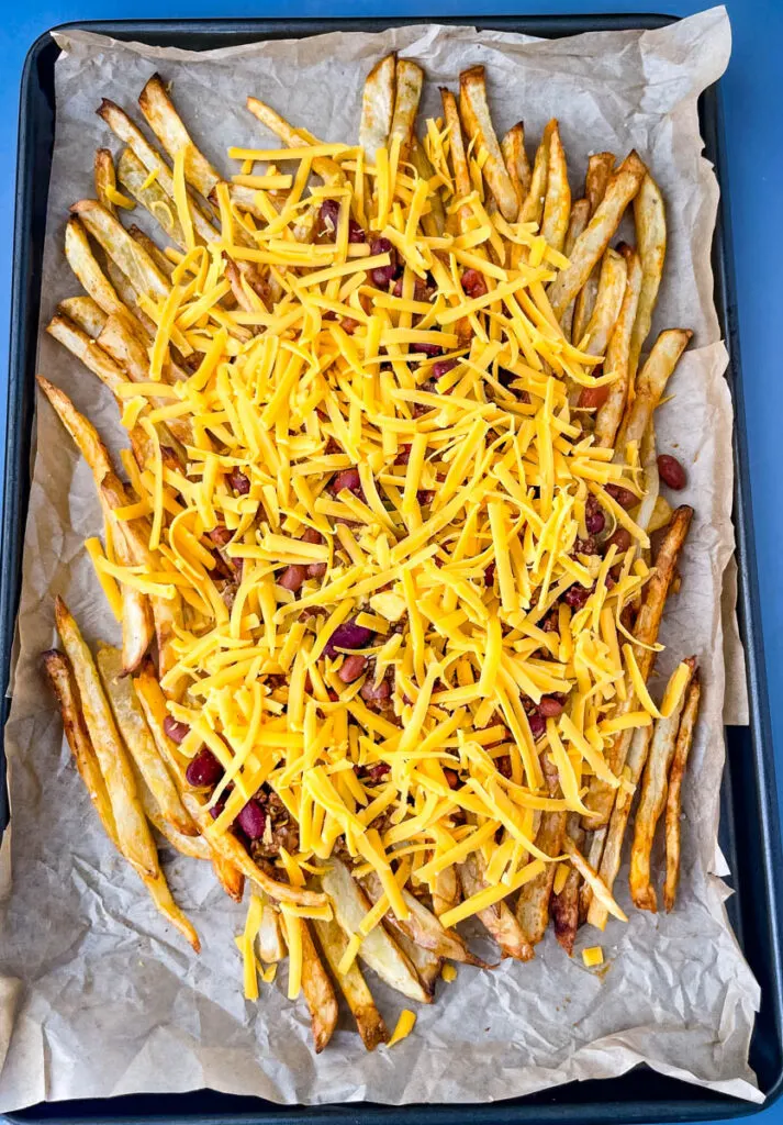 chili cheese fries on a sheet pan