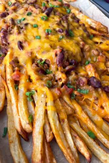 chili cheese fries on a sheet pan