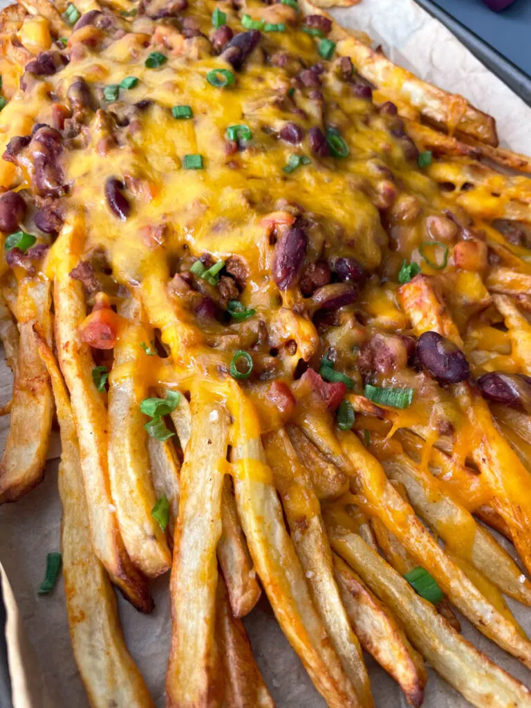 chili cheese fries on a sheet pan