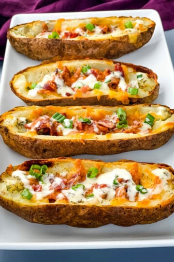 air fryer potato skins drizzled in ranch