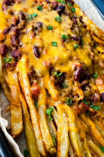 chili cheese fries on a sheet pan